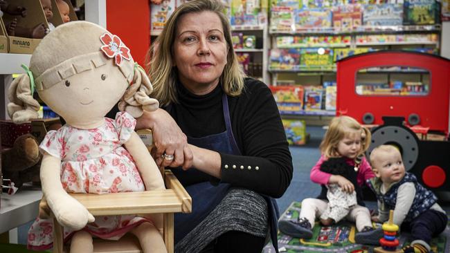 Windmill Educational Toys &amp; Supplies store manager Therese Kennedy, with kids Mitchell, 1, and sister Matilda, 3, at the shop. Picture: AAP / Mike Burton