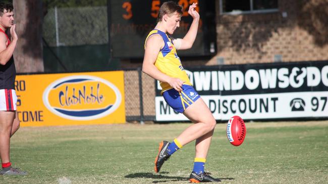 Bailey Lambert boots a goal for Noble Park last Saturday. Pic:Jenny Quaife.