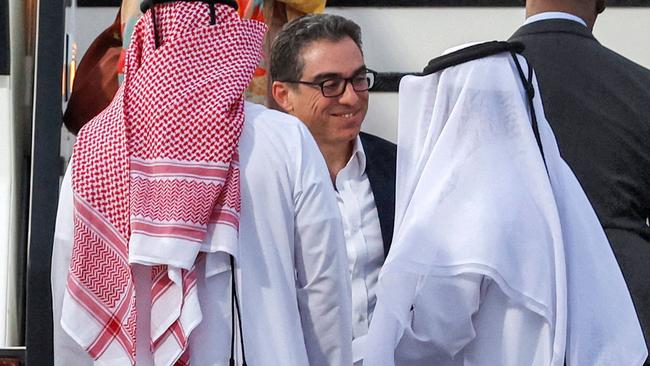 US citizen Siamak Namazi is received by officials upon disembarking from a Qatari jet upon their arrival in Doha. Picture: AFP