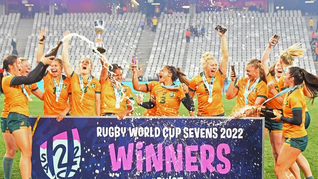 The Australian women's team spray champagne after beating New Zealand to win their section of the Rugby World Cup Sevens tournament in South Africa last year.