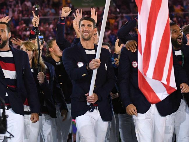 The USA's Michael Phelps carries the flag during the opening ceremony of Rio 2016.