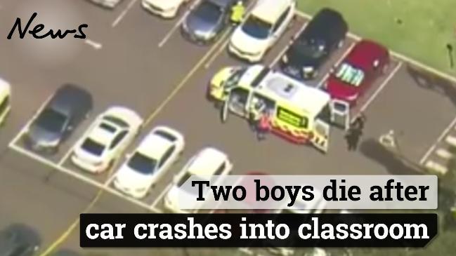 Two boys die after car crashes into classroom