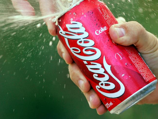 Coca-Cola (Coke) soft drink spraying from can being opened by Matthew Harris 03 Aug 2004. /can