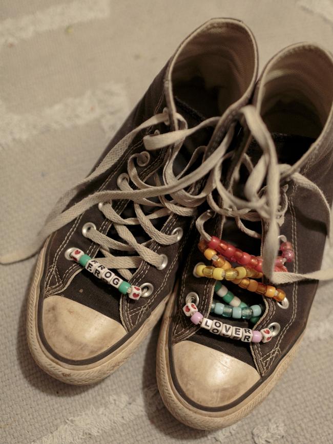 Birdie's shoes, decorated with beads that read “Frog Lover”. Picture: Sarah Blesener for WSJ