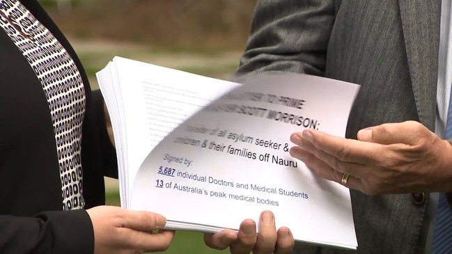 Doctors deliver a letter to the PM over asylum children on Nauru with 5,600 signatures