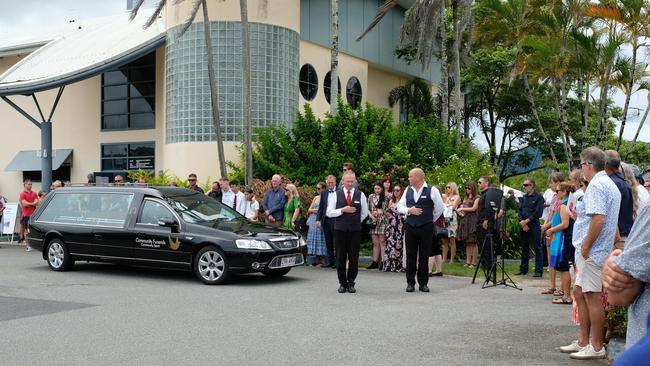 Mourners gather outside the Cairns Cruising Yacht Squadron for a final farewell to Andy Heard. PICTURE: TOBY VUE