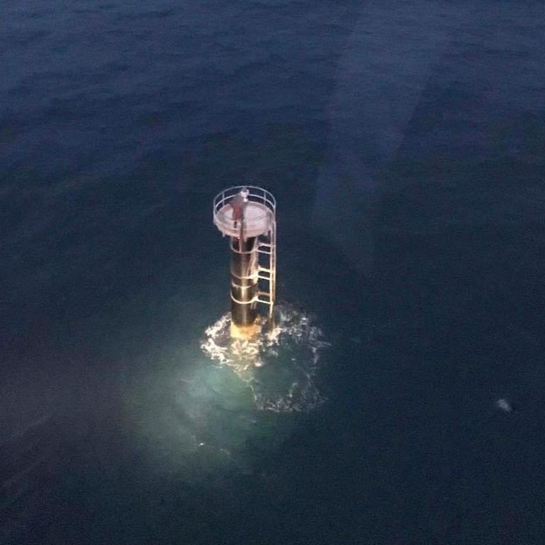 David Simpson standing on a navigation beacon before he was rescued. Picture: RACQ LifeFlight