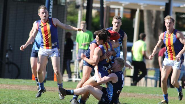 Glenunga's Alex Haren tackles Old Ignatians midfielder Sam Boots in the division three semi-final on Saturday. Picture: AAP/Russell Millard