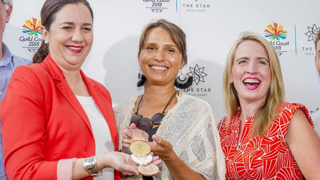 Gold Coast Commonwealth medals artist, Delvene Cockatoo-Collins, with Queensland Premier Annastacia Palaszczuk and Tourism Minister Kate Jones. Picture: Jerad Williams