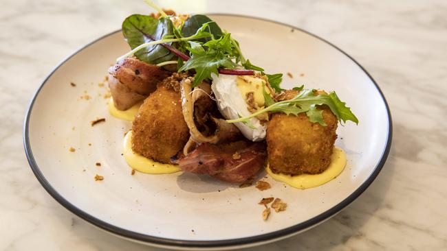 The mac ‘n’ cheese benedict at Goodness Gracious. Picture: Mark Cranitch.