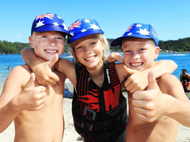 Celebrating Australia Day at Tallebudgera Creek were Palmy 10 year old twins Geoff and James Bellwood with little sister Grace (9) Photo: Scott Powick.