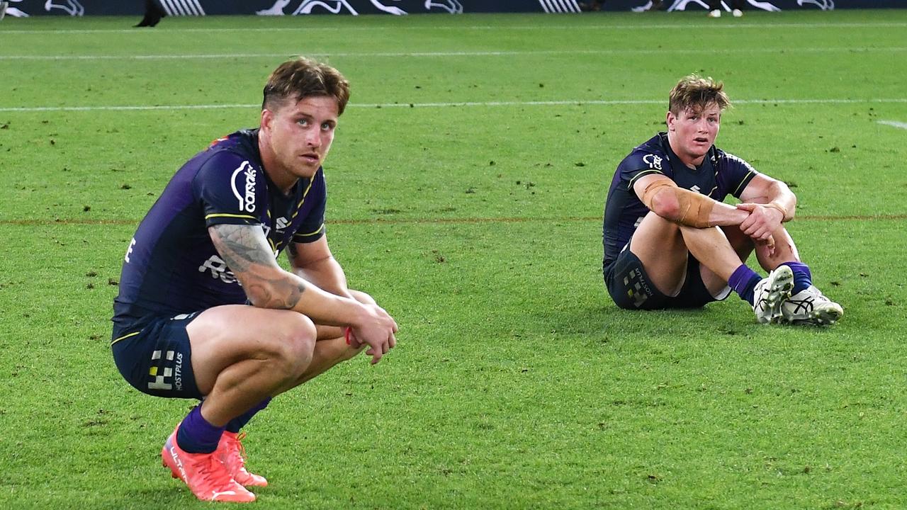 BRISBANE, AUSTRALIA – SEPTEMBER 25: Cameron Munster and Harry Grant of the Storm looks dejected after defeat during the NRL Preliminary Final match between the Melbourne Storm and the Penrith Panthers at Suncorp Stadium on September 25, 2021 in Brisbane, Australia. (Photo by Bradley Kanaris/Getty Images)