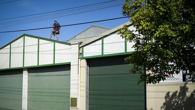 A man was seen working on the roof of the factory a day after Mr Wright died. Picture: AAP/Mike Burton