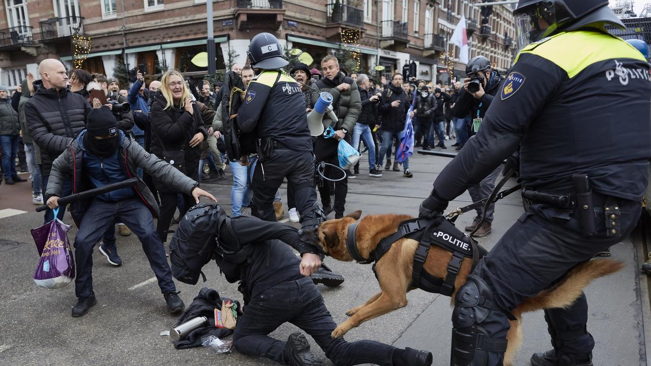 Clashes erupt between anti-riot officers and anti-vaxxers affiliated to far-right parties in Amsterdam, Netherlands. Picture: Pierre Crom/Getty Images