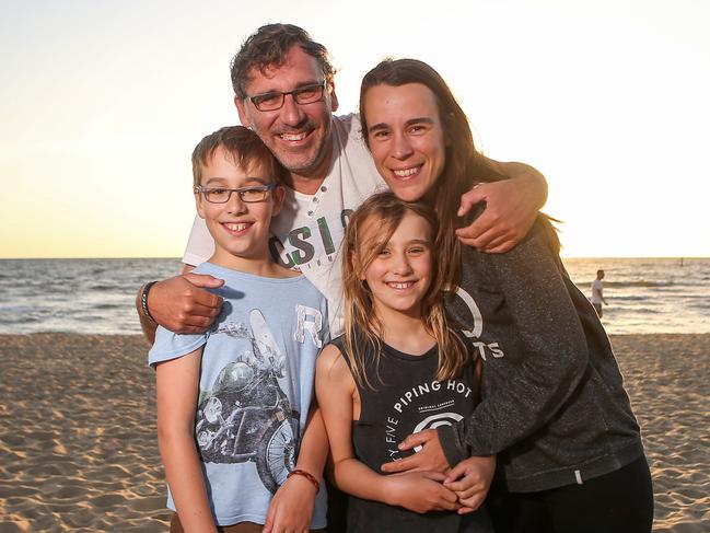 The Van Den Brink family from left: Merlijn, 11, Bas, Resa, 9, and Anke enjoy New Year’s Eve on St Kilda beach. Picture: Martin Keep