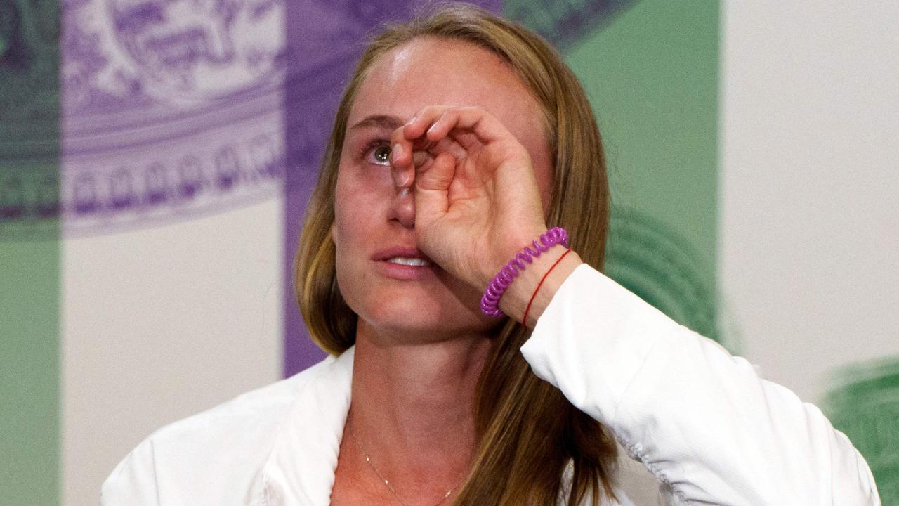 Kazakhstan's Elena Rybakina cries as she gives a press conference in the Main Interview Room after winning against Tunisia's Ons Jabeur in their women's singles final tennis match on the thirteenth day of the 2022 Wimbledon Championships at The All England Tennis Club in Wimbledon, southwest London, on July 9, 2022. (Photo by Joe TOTH / various sources / AFP)