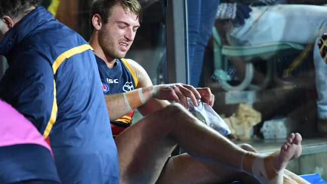 Daniel Talia nurses his injured ankle on Friday night.