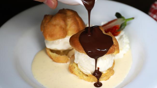 Bistro Papillon’s profiterole, ice cream and chocolate sauce. Picture: Jenifer Jagielski