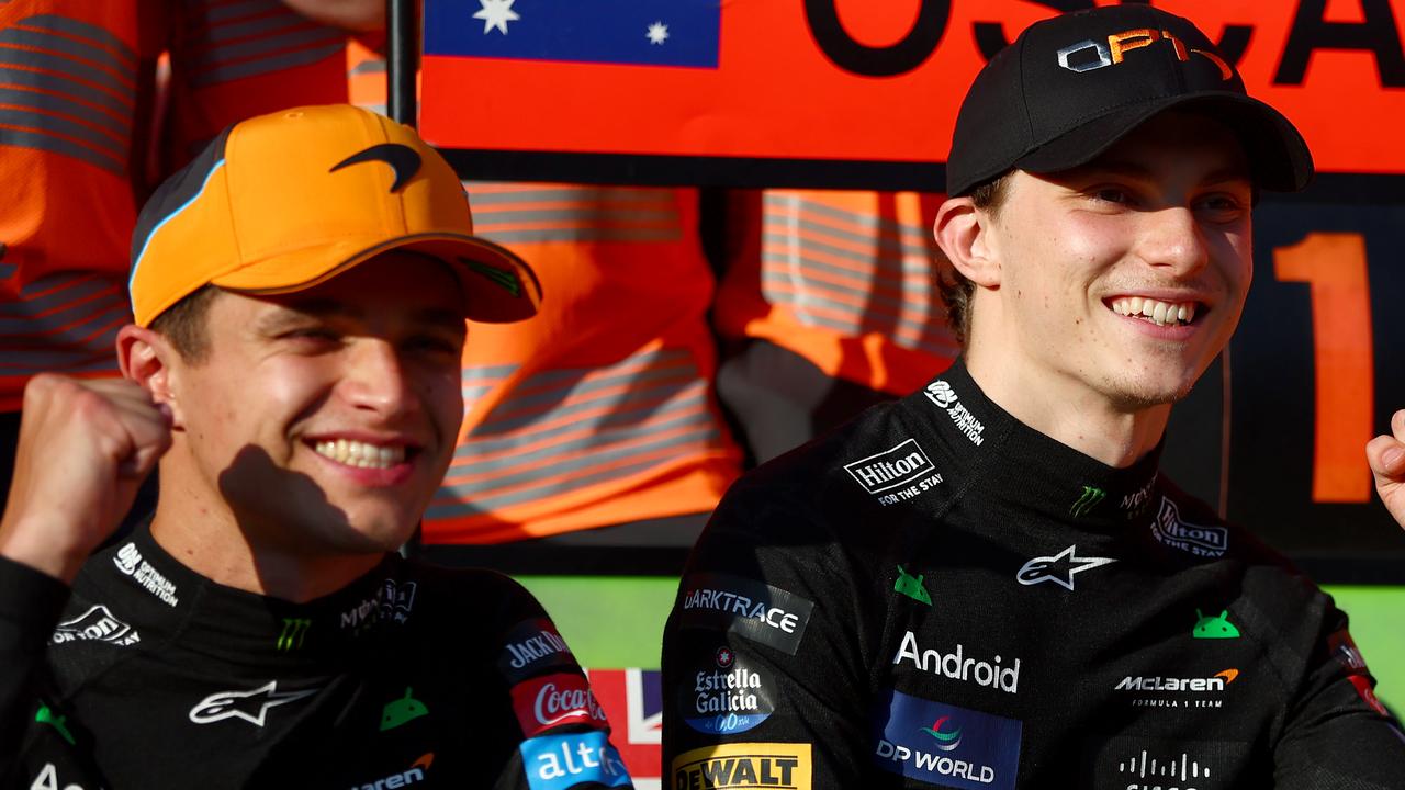 BUDAPEST, HUNGARY - JULY 21: Race winner Oscar Piastri of Australia and McLaren and Second placed Lando Norris of Great Britain and McLaren pose for a photo to celebrate with their team after the F1 Grand Prix of Hungary at Hungaroring on July 21, 2024 in Budapest, Hungary. (Photo by Joe Portlock - Formula 1/Formula 1 via Getty Images)