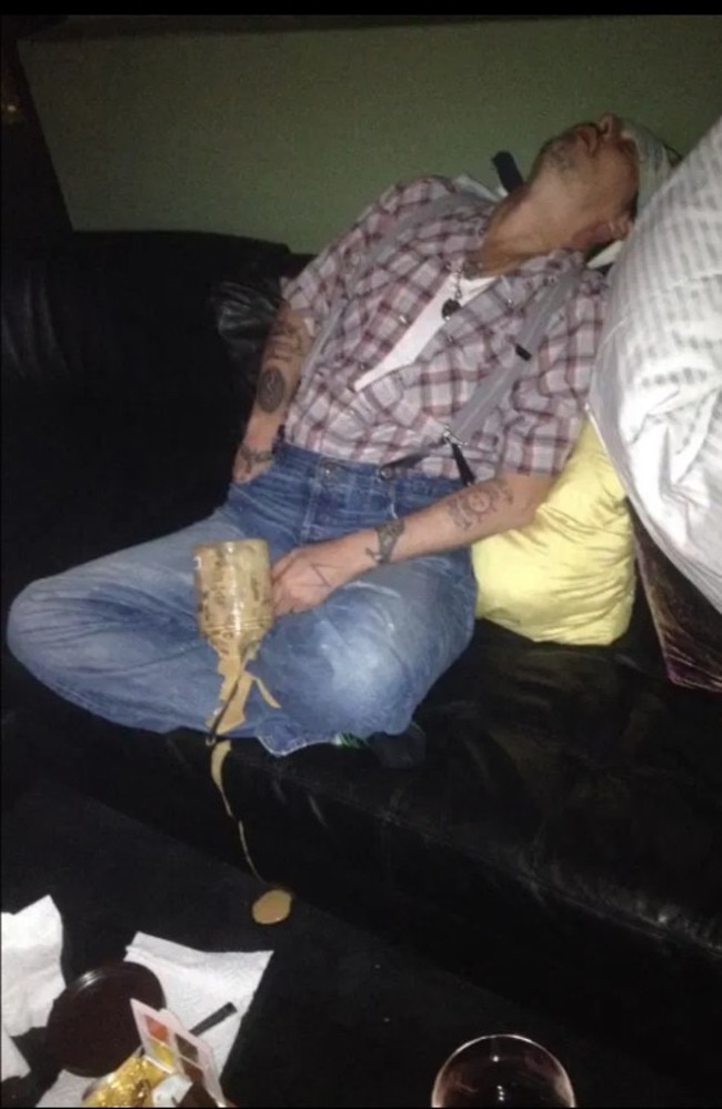 Johnny Depp pictured passed out with ice-cream dripping down his lap.