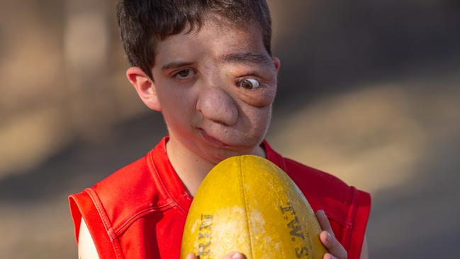 Nicholas Daisley is a keen AFL fan and player. Picture: Steve Vit