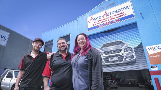 Amato Automotive apprentice Eric Lincoln, with owner Adrian Amato and wife Michelle. Picture: Wayne Taylor