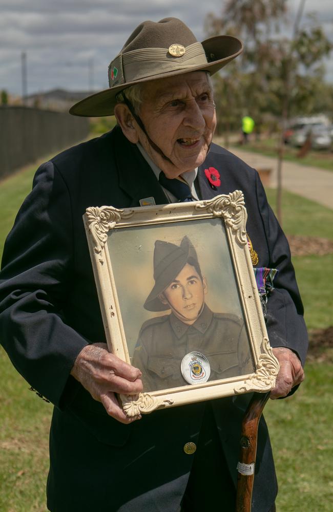 World War II Digger, Allan Godfrey, with a picture of him as a young lad. Picture: Caroline Springs RSL