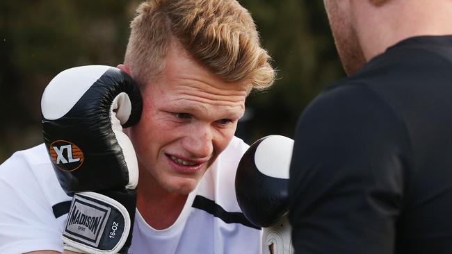 Adam Treloar puts on the boxing gloves at Collingwood’s Falls Creek camp.