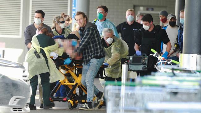 A stabbing victim is rushed to hospital in Auckland. Picture: Alex Burton / New Zealand Herald