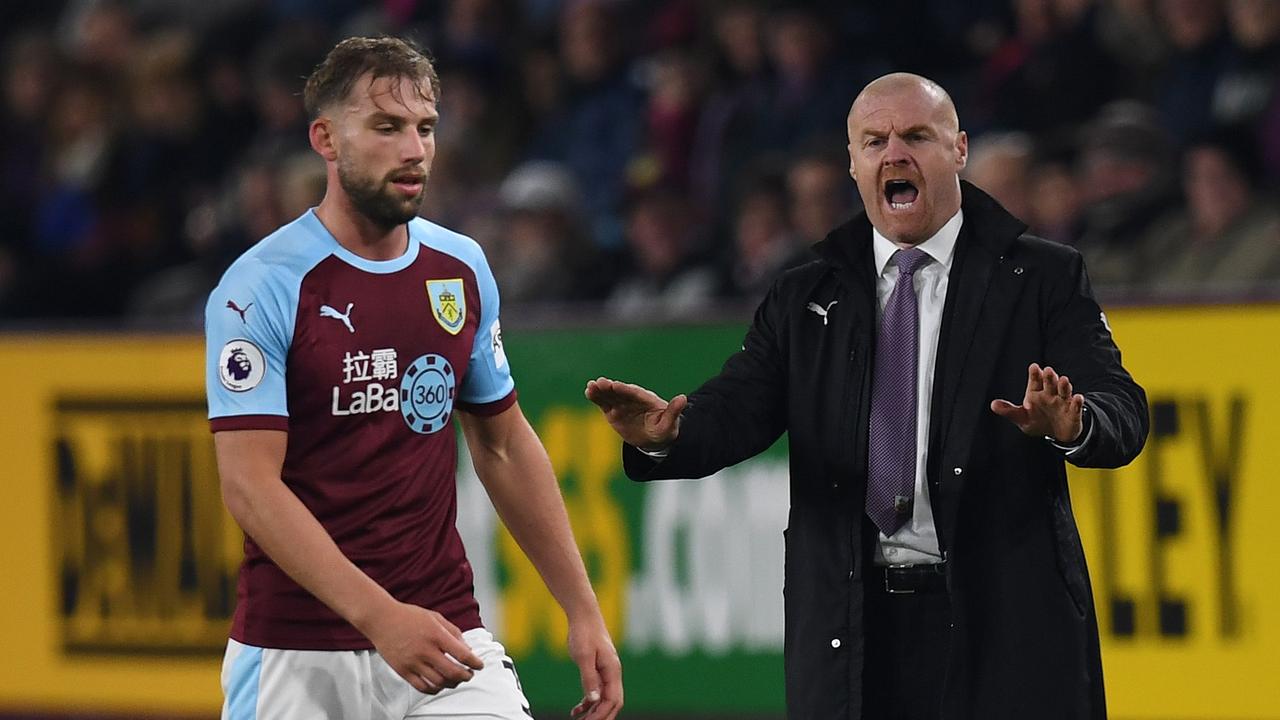 Burnley's English manager Sean Dyche (R) shouts instructions to his players from the touchline