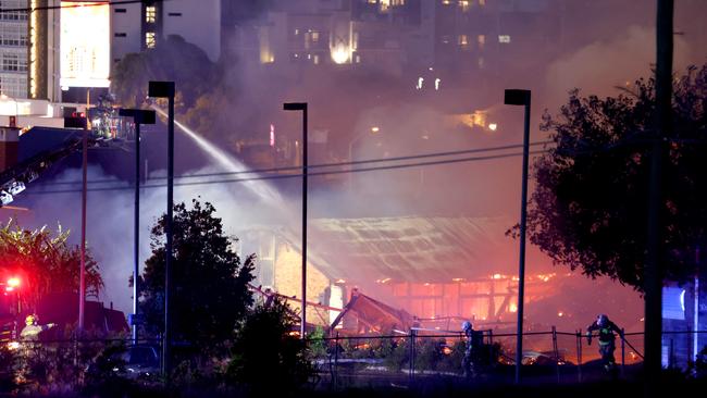 Multiple fire units spray water on buildings on fire in Hubert St. Picture: Steve Pohlner