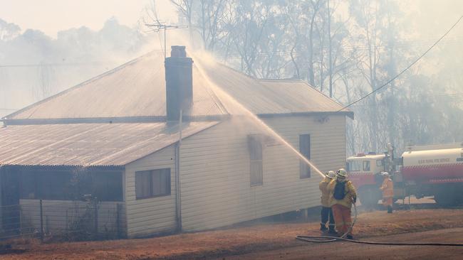 Firefighters save a house north of Cessnock. Picture: Peter Lorimer