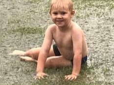 Jack and Ryan Flohr play in the rain for the first time. Image, supplied: Case Flohr.