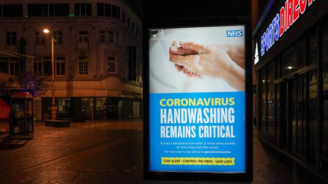 A coronavirus advice sign illuminates an empty town centre street on October 02, 2020 in Middlesbrough, England. Picture: Ian Forsyth/Getty Images