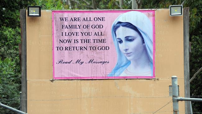 A sign out at the front gate of the cult’s compound at Bangalee near Nowra in 2014. Picture: Simon Bullard