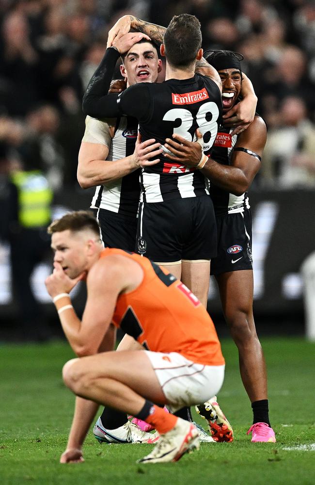 Brayden Maynard, Jeremy Howe and Isaac Quaynor celebrate Collingwood’s thrilling preliminary final victory.