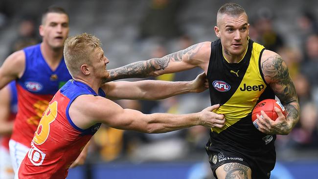 Dustin Martin fends off Nick Robertson during their Round 17 clash.