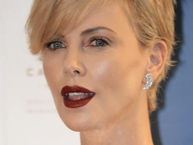 Actress Charlize Theron poses for photographers during a promotional event in Hong Kong, Wednesday, Oct. 28, 2015. (AP Photo/Vincent Yu)