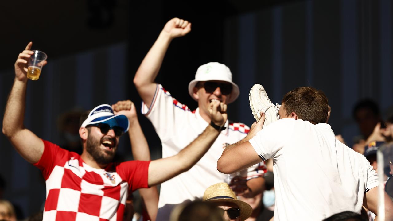 A fan drinks from a shoe during the ‘Special Ks’ second round doubles win. Picture: Darrian Traynor/Getty Images