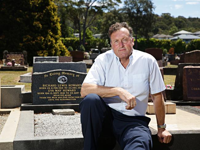 Michael Howard at his parents’ grave at Mona Vale Cemetery. Picture: Adam Yip