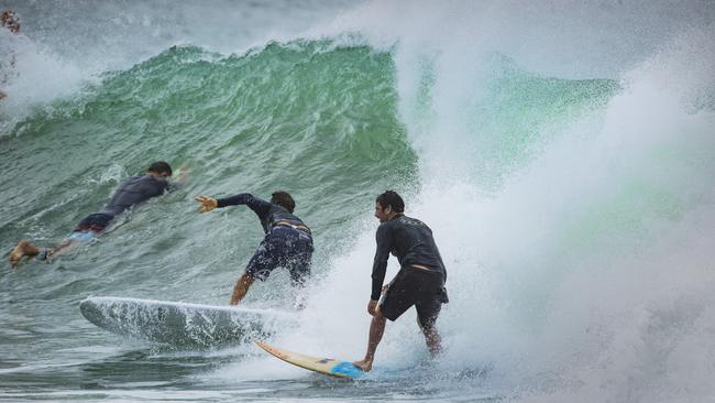 Surfers in action at the Noosa National Park taking advantage of the swell whipped up by ex-Tropical Cyclone Seth. Picture: Lachie Millard