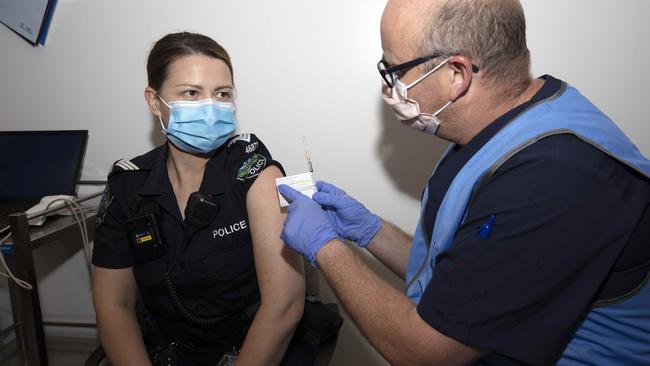 Police officer Amanda Kuchel receives her first injection of COVID-19 vaccine at The Royal Adelaide Hospital. Picture: NCA NewsWire/Emma Brasier