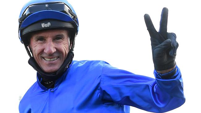 Glen Boss celebrates winning the Darley Sprint Classic at Flemington on the final day.