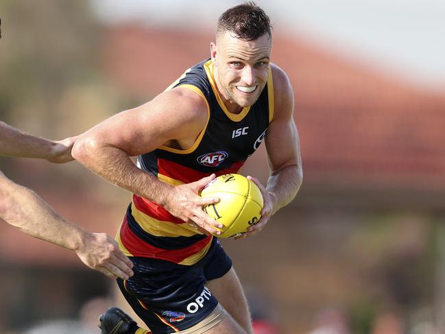 AFL - 02/03/19 - JLT Series - Crows v Port Adelaide at Port Pirie. Brodie Smith runs away from Sam Gray. Picture SARAH REED