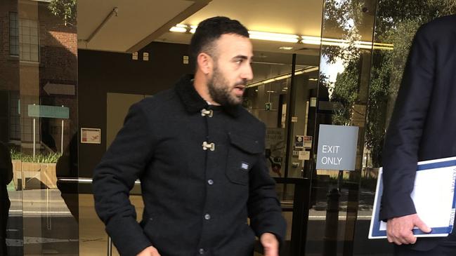 Marc Yaacoub leaves Parramatta Local Court with his lawyer.