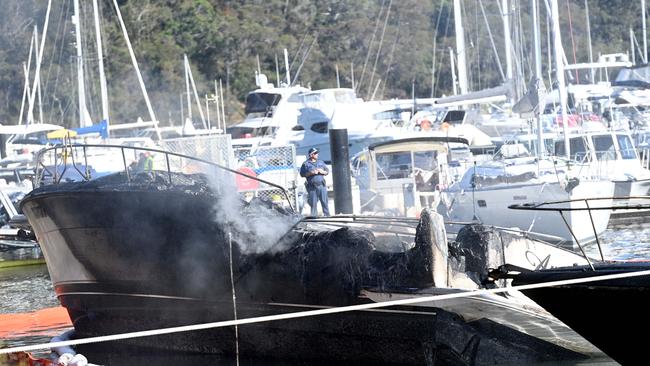 Fire and Rescue extinguish a blaze that destroyed three boats at Church Point this morning. Picture: Jeremy Piper