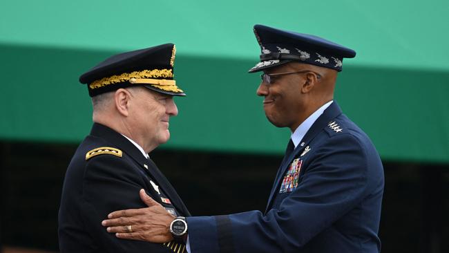 Mark Milley greets his successor Charles Brown in Arlington, Virginia, on Friday. Picture: AFP