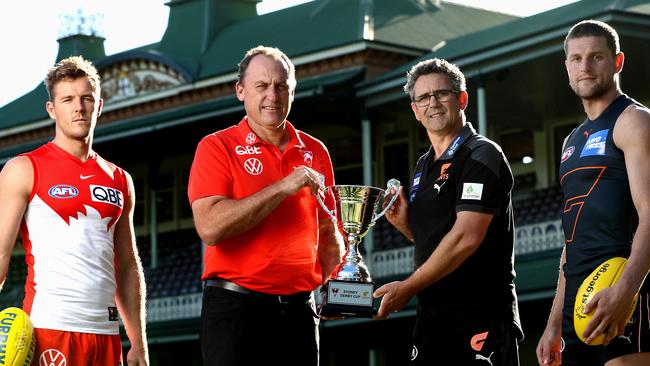 Luke Parker, John Longmire, Leon Cameron and Jacob Hopper and the trophy they will play for in Saturday’s Sydney Derby XX at SCG.