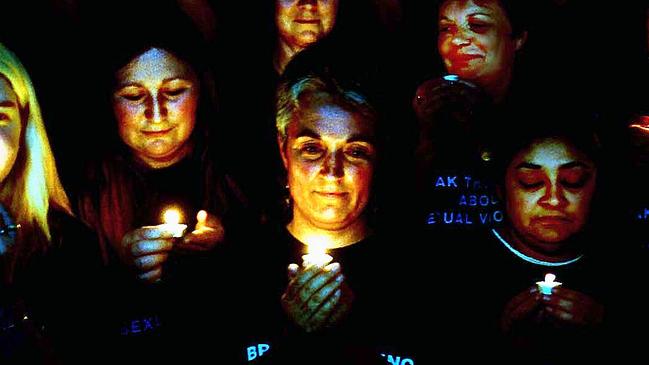 Women from the Penrith Womens Health Centre holding a candlelit vigil during the 'Day of Action Against Sexual Violence'. 26/8/99. Picture: david Hill