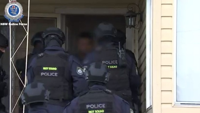 Police have arrested two men at homes in Smithfield and Cartwright early on Tuesday April 4. Picture: NSW Police